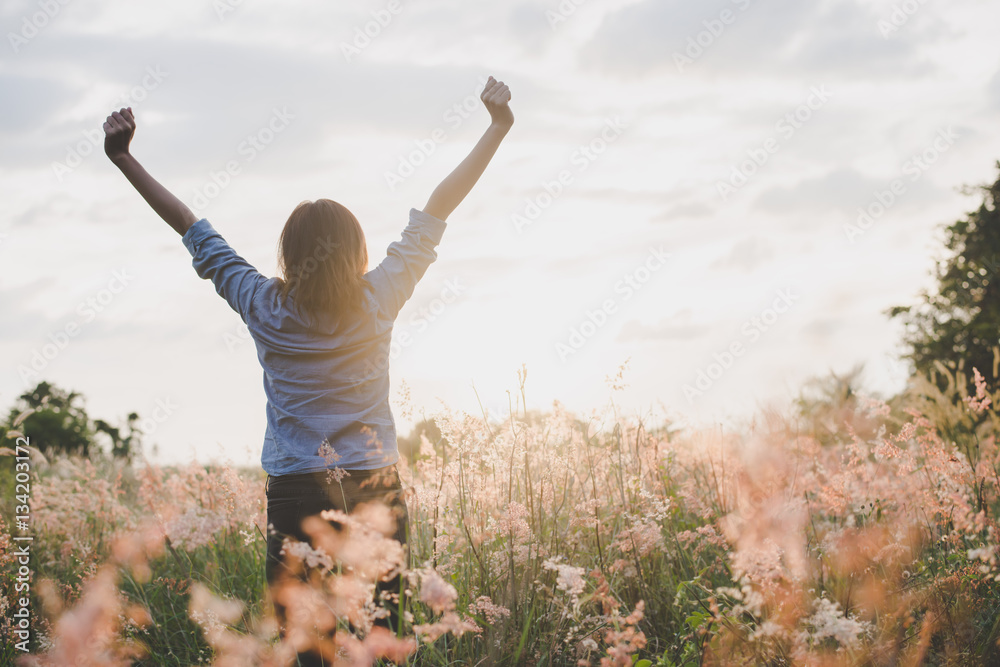 Young beautiful woman standing stretch her arms in the air on th Young beautiful woman standing stretch her arms in the air on th