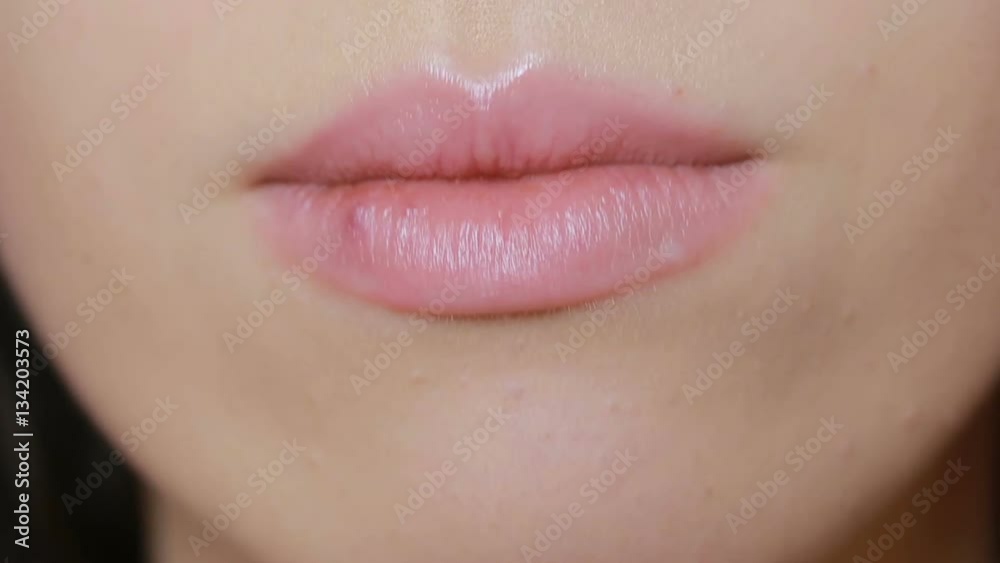 girl touching sores on the lips. herpes. lip treatment, Young plump