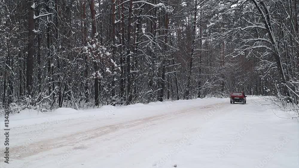 Car drive through on a country road in winter forest. Car drive through on a country road in winter forest.