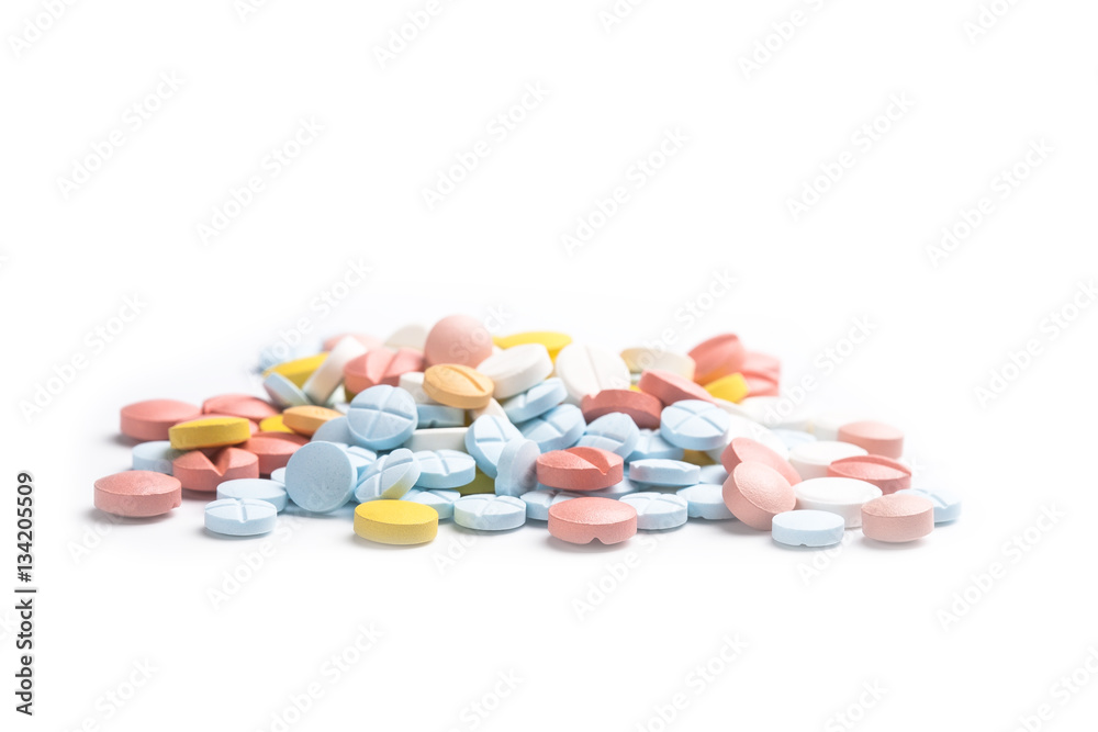 Heap of colored medicine pills on the light background Heap of colored medicine pills on the light background