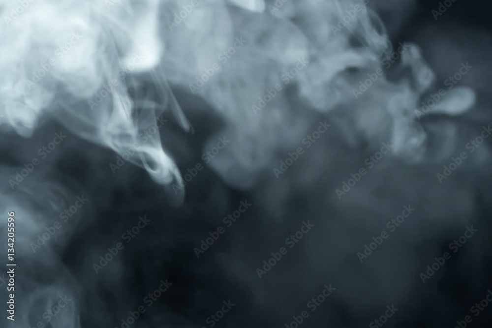 smoke slowly floating through space against smoke slowly floating through space against