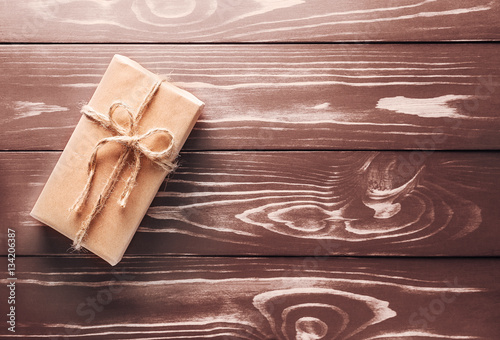 One gift on the old wooden background