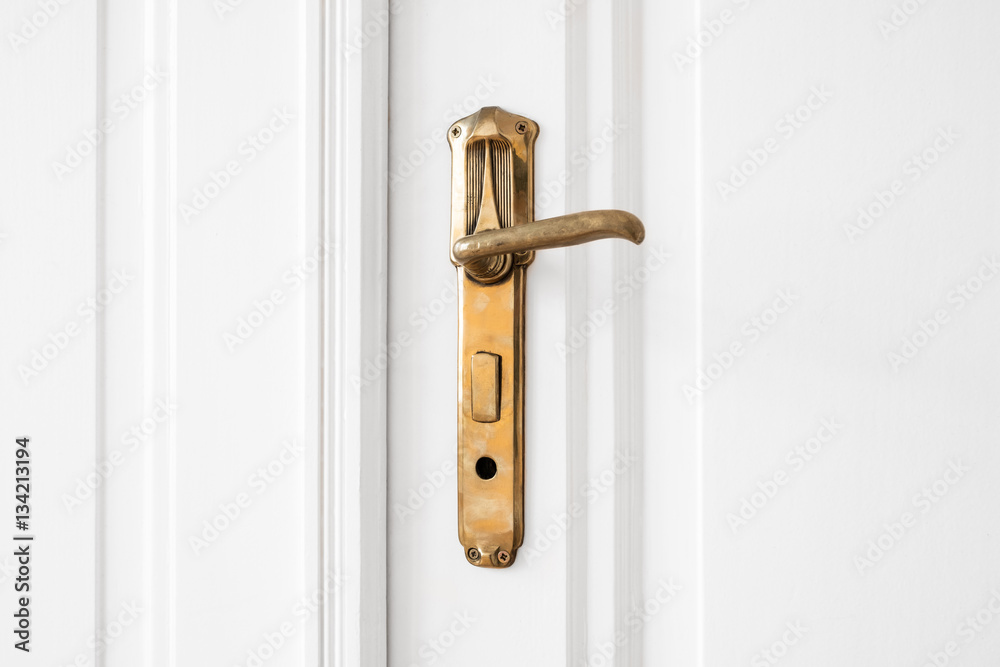 Obraz premium old door handle on white door