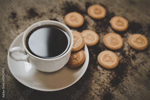 black coffee cup with cookies photo