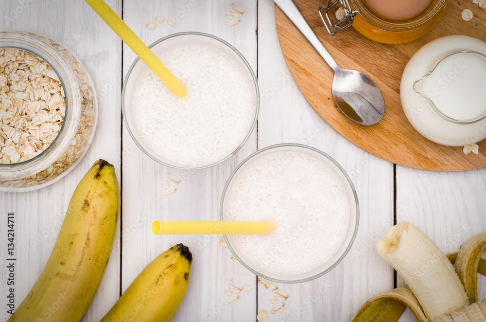 Milk shake with banana, oatmeal and honey, healthy breakfast Milk shake with banana, oatmeal and honey, healthy breakfast