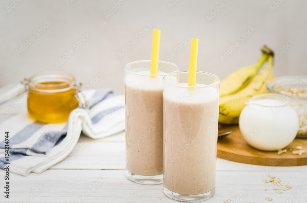 Milk shake with banana, oatmeal and honey, healthy breakfast Milk shake with banana, oatmeal and honey, healthy breakfast