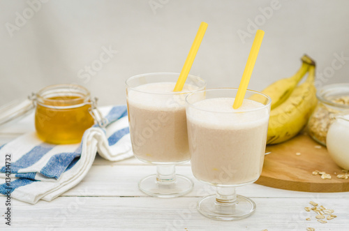 Milk shake with banana, oatmeal and honey, healthy breakfast