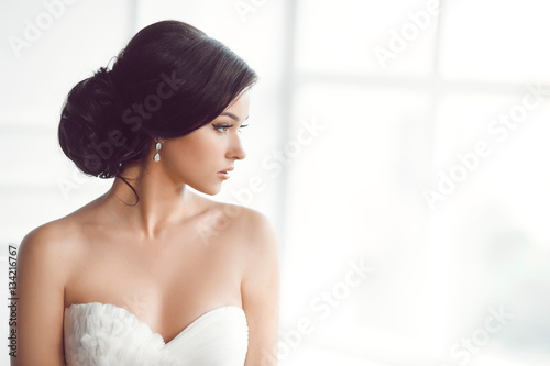 Beautiful bride. Wedding hairstyle make-up luxury fashion dress concept