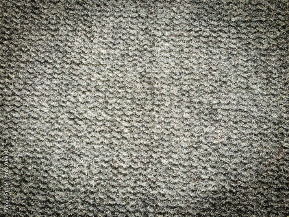The knitted fabric texture, soft focus abstract background The knitted fabric texture, soft focus abstract background