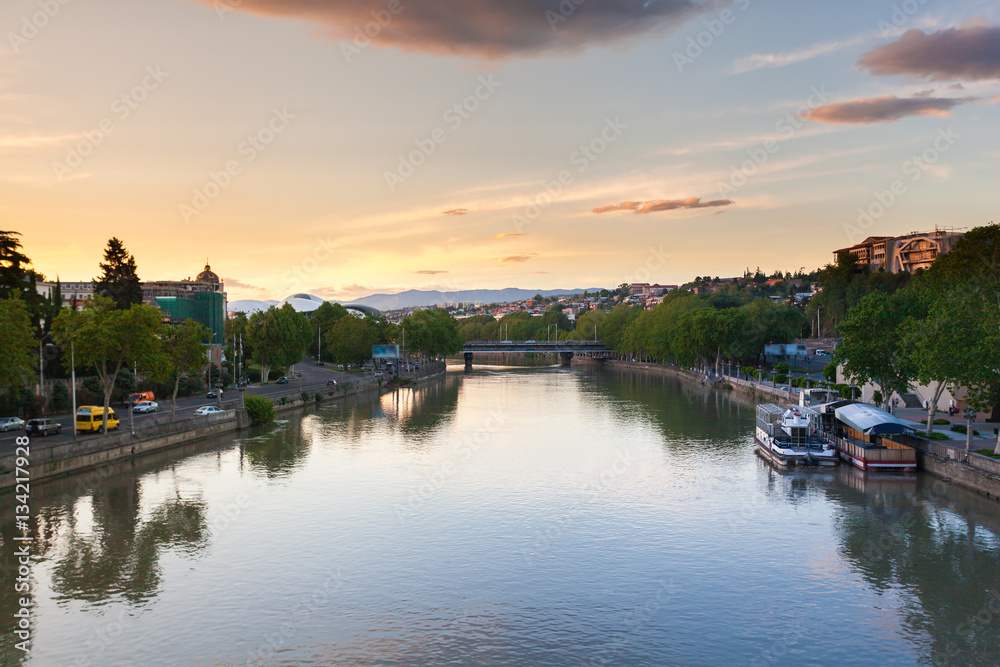 Panorama of the City of Tbilisi and the river Mtkvari from the Bridge of Peace at sunset
