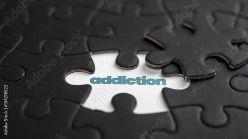 Word addiction under jigsaw puzzle piece