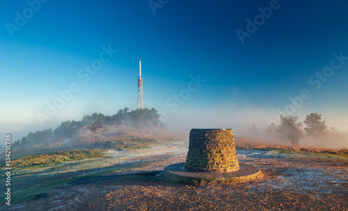 Transmitting Station at the Top of Hill in Morning Mist and Sunrise