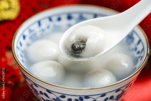 sweet rice dumplings in blue and white porcelain bowl,Chinese Lantern Festival photo