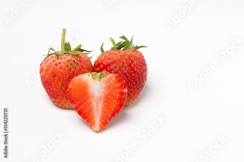 Red strawberry sliced on white background