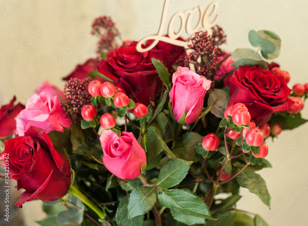 A bouquet of flowers and gifts for the holiday, for lovers, rose for women.