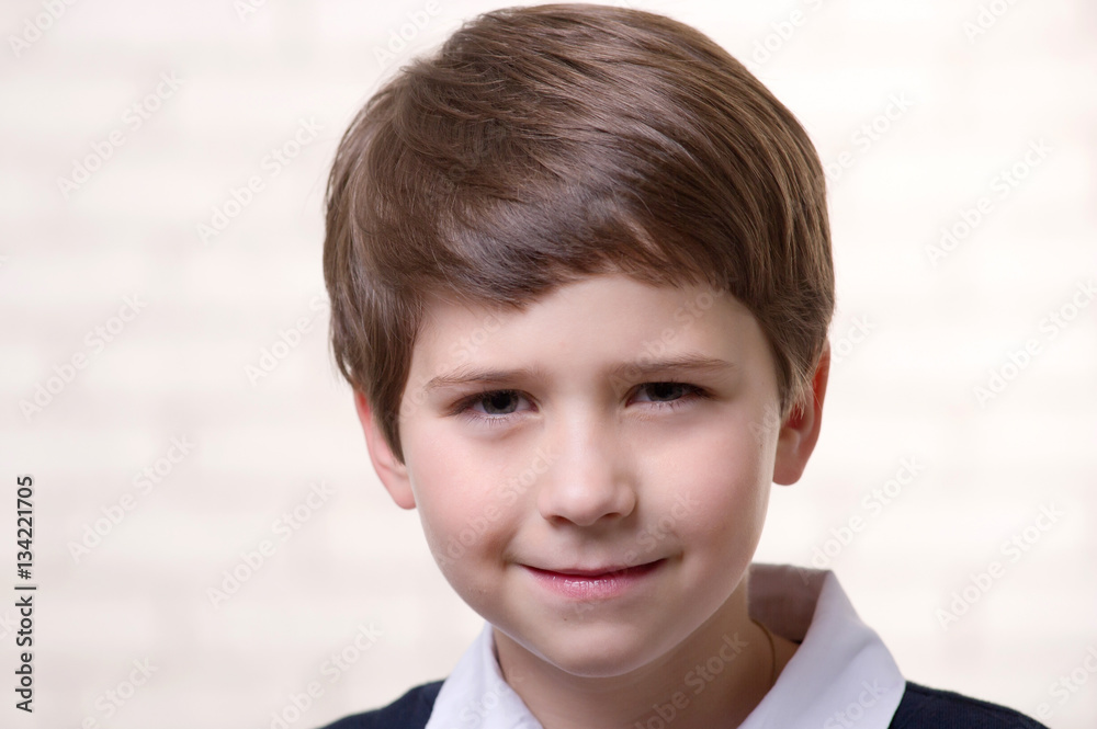 Portrait of a beautiful, caucasian boy on a bright background. Portrait of a beautiful, caucasian boy on a bright background.