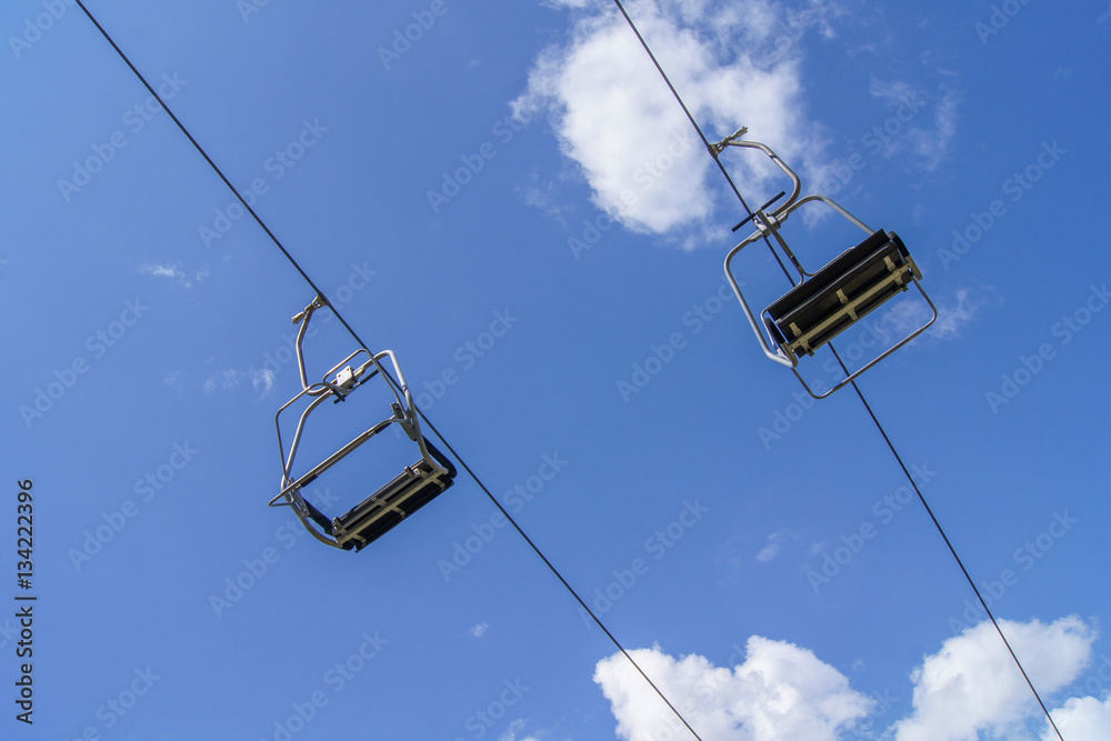 Empty ski lift with blue sky