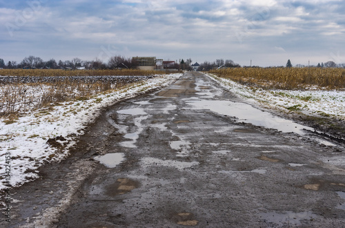 Rural landscape road leading to Trinity Temple in Ukrainian village Velyki Budischa, Poltavskaya oblast, Ukraine