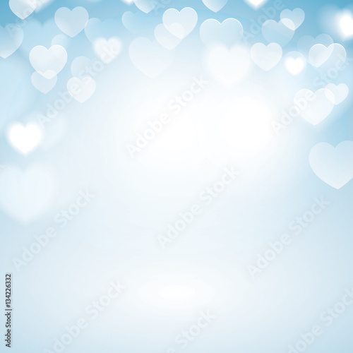 Romantic Bokeh background with heart lights. Blurred blue background.