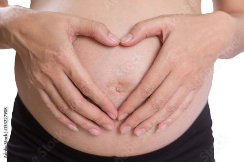 Wallpaper Mural Pregnant woman making a heart with her hands on her belly Torontodigital.ca