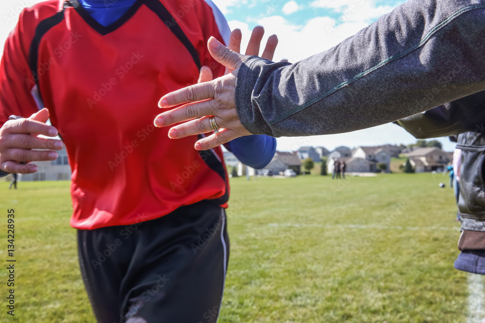 High Five line after a childs soccer game High Five line after a childs soccer game