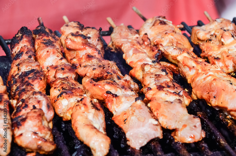 Closeup of chicken skewers kebabs on grill