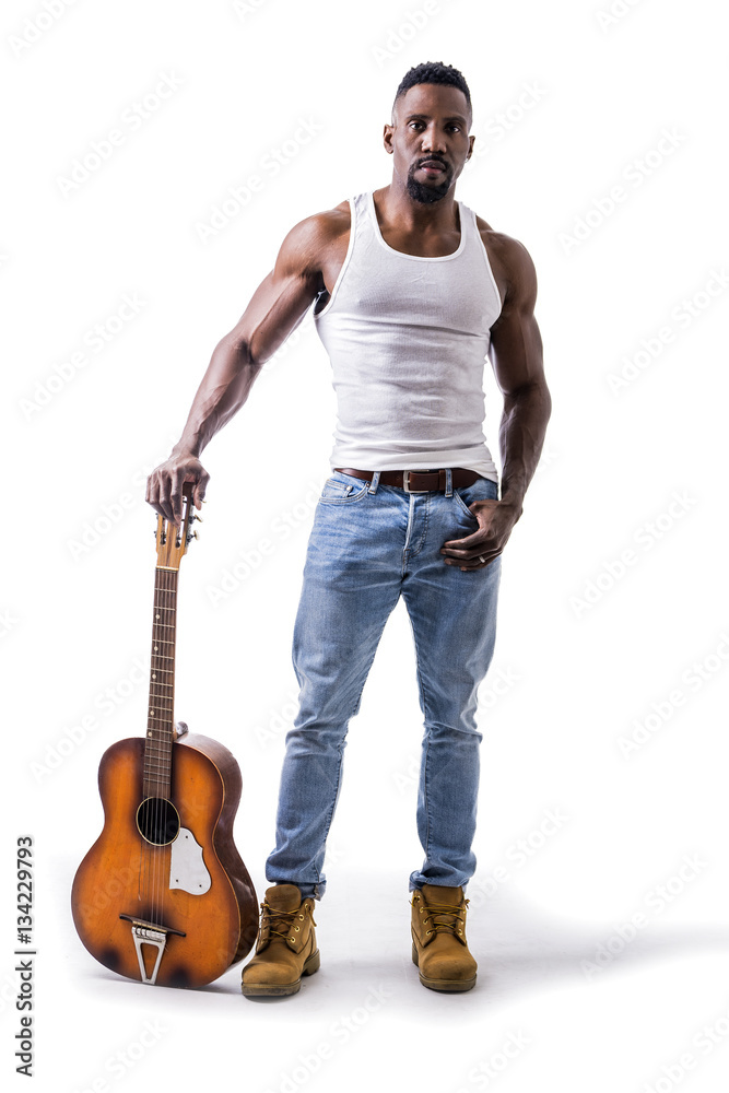 Muscular black man playing guitar, wearing jeans and white tank-top Stock  Photo | Adobe Stock