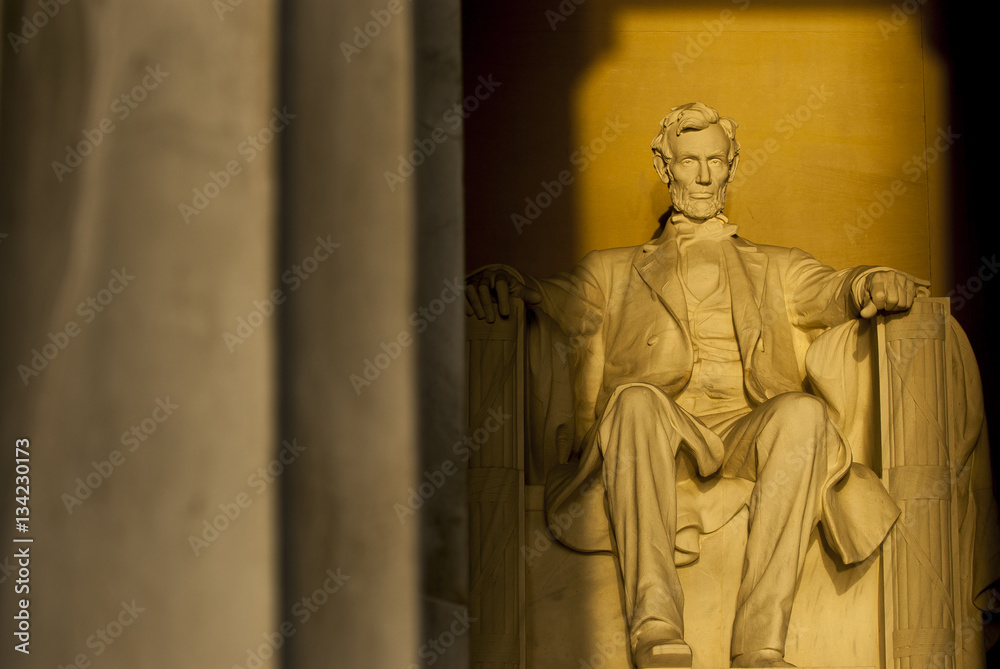 Statue of Abraham Lincoln in brilliant warm dramatic morning sunlight Statue of Abraham Lincoln in brilliant warm dramatic morning sunlight