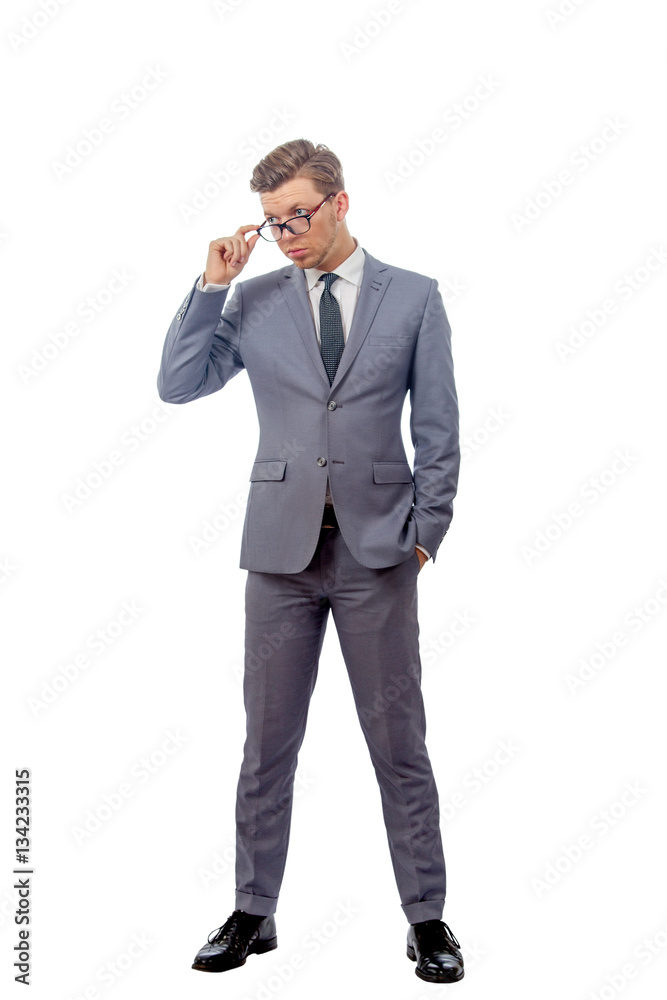 young man in a business suit wearing glasses young man in a business suit wearing glasses