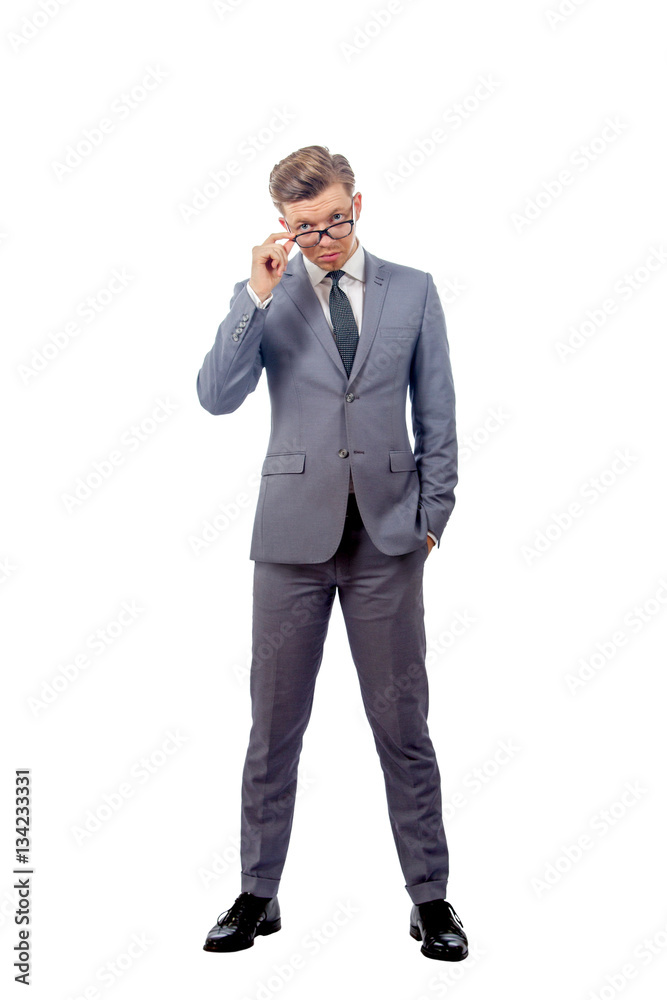 young man in a business suit wearing glasses young man in a business suit wearing glasses