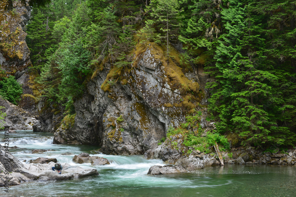 Man prepares to fish in British Columbia, Canada Man prepares to fish in British Columbia, Canada