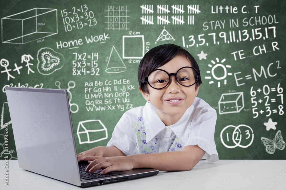 Cute Student using Laptop And Smiling at Camera Cute Student using Laptop And Smiling at Camera