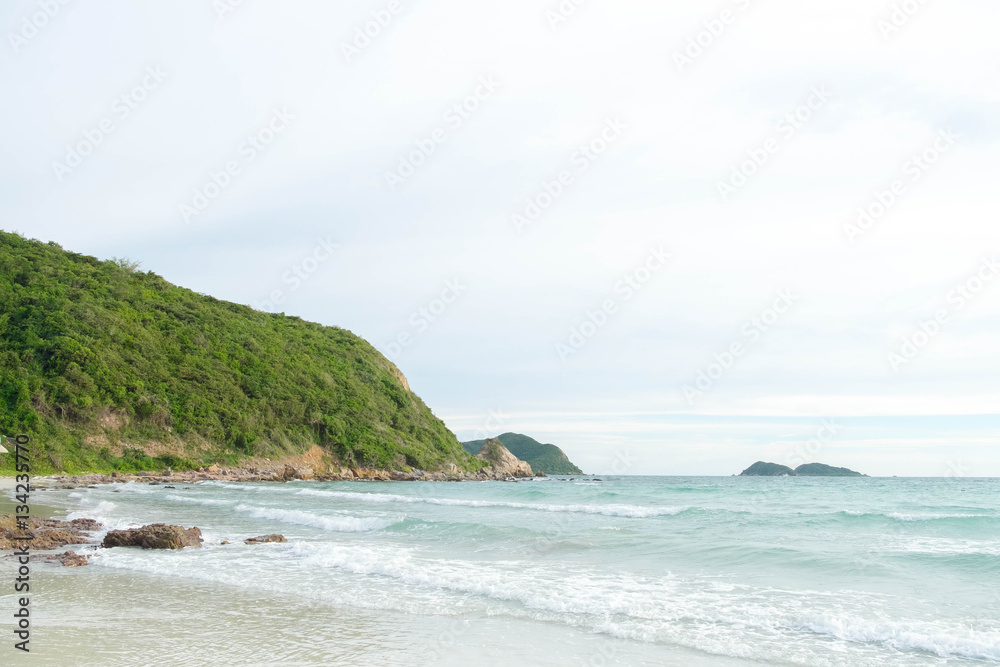 the green big mountain with sea sand sun and the beach on sunshine day and bright sky and cloud background.