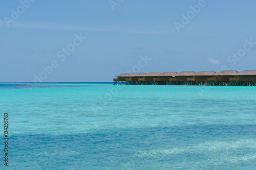 Beautiful tropical Maldives resort hotel and island with beach and sea on sky for holiday vacation background concept -Boost up color Processing © tirachard