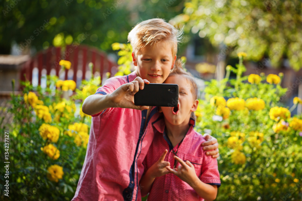 Best Friends. Two Cute Little Boys Doing Selfie And Making Funny Faces 