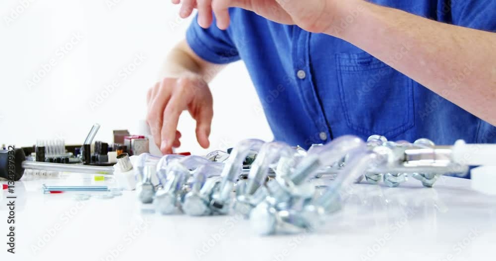 Computer engineer repairing computer motherboard Computer engineer repairing computer motherboard