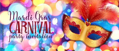 Golden carnival mask with red feathers on colorful bokeh background