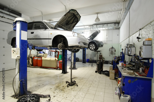 Car on a lift in a car repair station