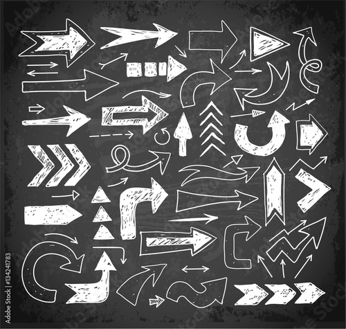 Sketch arrow collection for your design on blackboard background. Hand drawn with ink. Vector illustration.