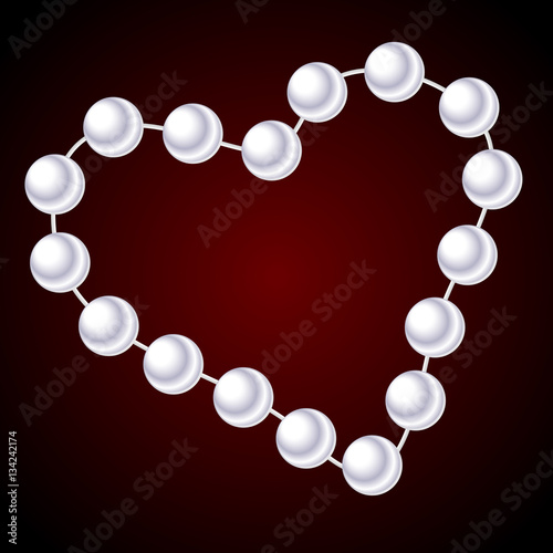 white necklace in the shape of heart