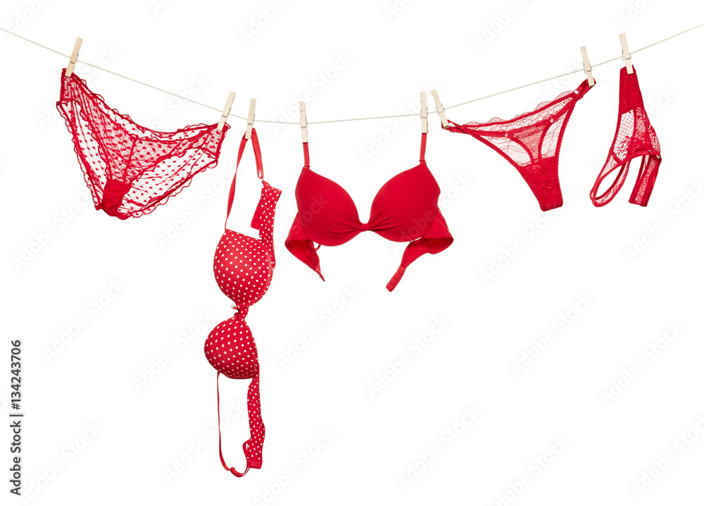 Female panties and bra hanging on rope Stock Photo