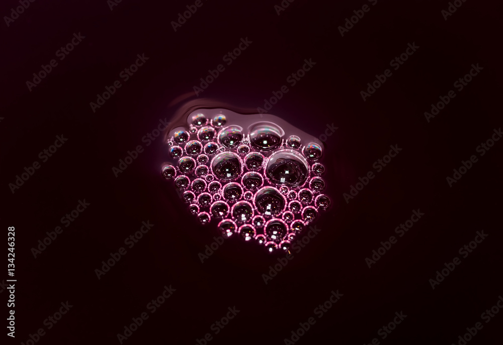 Bubbles of red wine closeup. Alcoholic background Bubbles of red wine closeup. Alcoholic background