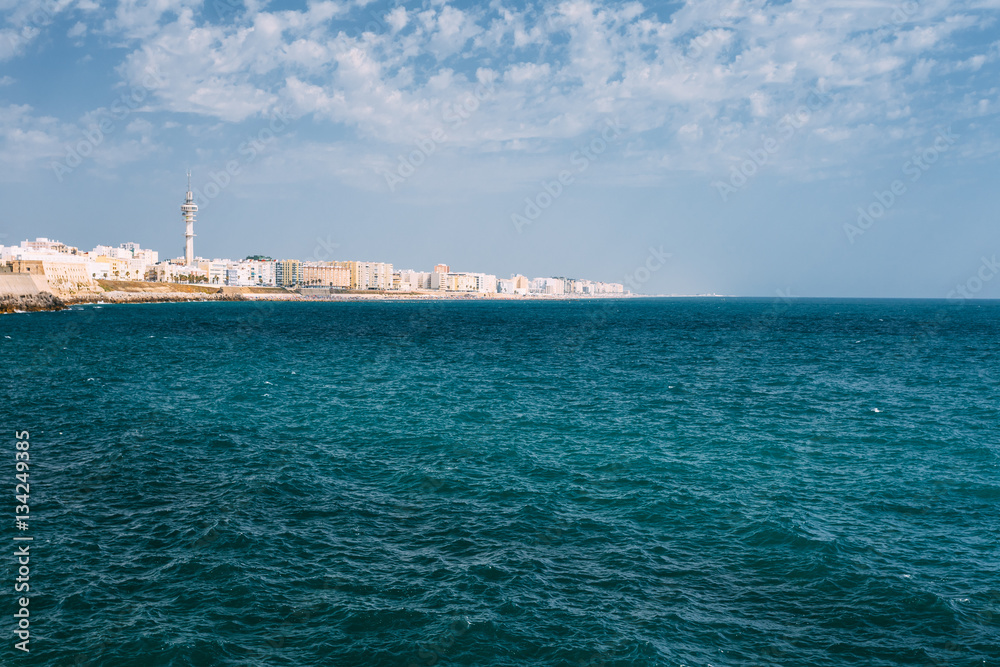 Cityscape of Cadiz town in Spain. Blue sky and sea