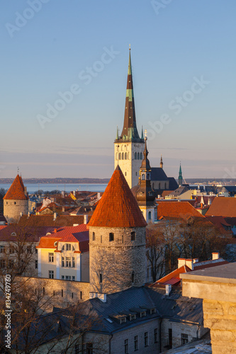 Sunset over Old City Town Tallinn In Estonia. St. Olaf (Oleviste) Church and towers.