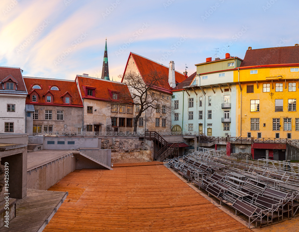 Open air theatre in old town of Tallinn. Beautiful sunset view of medieval buildings.