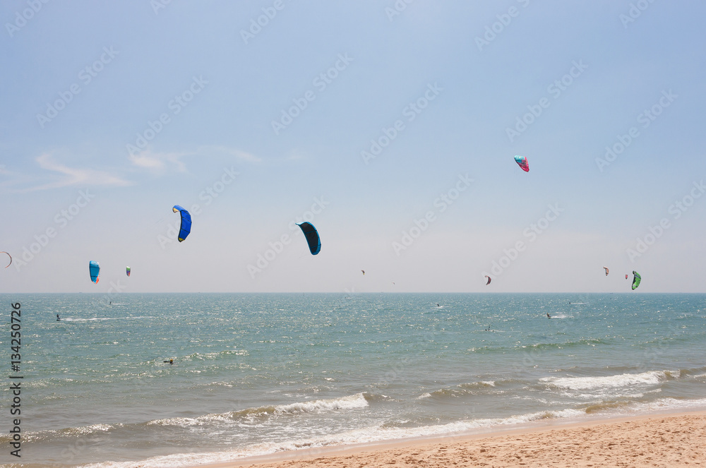 Unidentified people involved in kitesurfing Unidentified people involved in kitesurfing