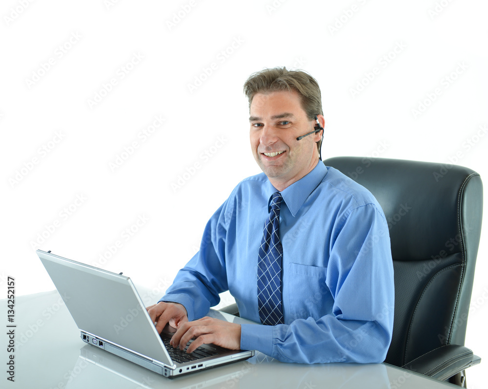 Business man on a call while working on laptop or customer service representative helping people Business man on a call while working on laptop or customer service representative helping people