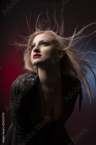 Glamor young blonde woman with hair in motion