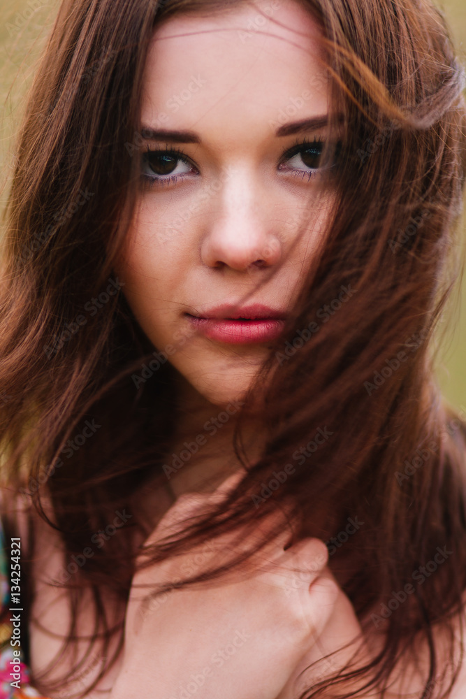 Cute young girl face close up portrait with streaming hair. Cute young girl face close up portrait with streaming hair.