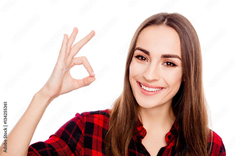 Happy beautiful girl showing ok gesture and smiling Happy beautiful girl showing ok gesture and smiling
